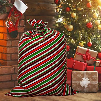 Borse di plastica variopinte dell'involucro di regalo per la festa di Natale