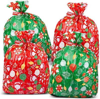 Progetti le borse per il cliente di plastica variopinte dell'involucro di regalo per l'imballaggio enorme del presente di natale